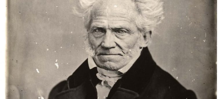 Black and white portrait of an elderly man with a serious expression.
