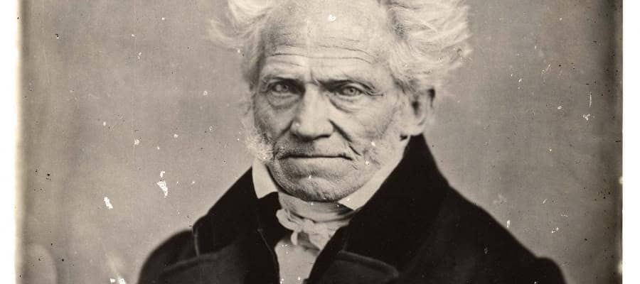 Black and white portrait of an elderly man with a serious expression.