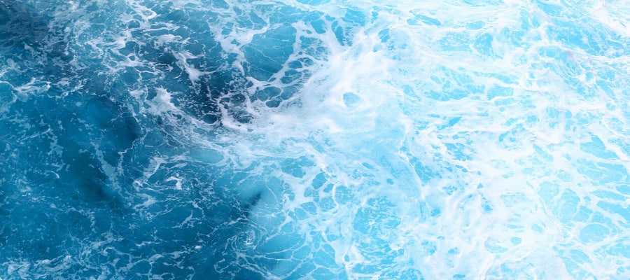 Ocean water with white foam and waves.