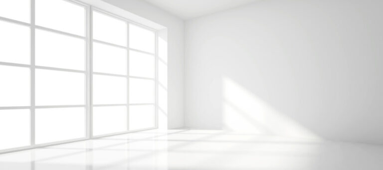 Bright, minimalist room with large window; sunlight streams in.