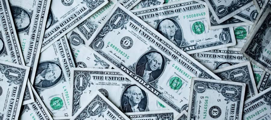 Close-up of a pile of one-dollar bills.