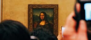 Close-up view of the Mona Lisa, a famous painting exploring the concept of beauty.