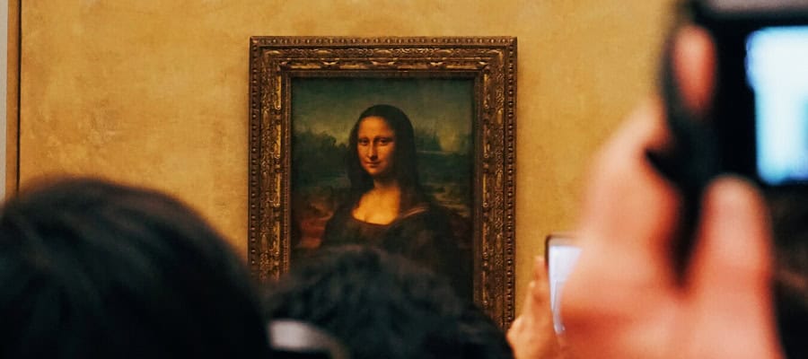 Close-up view of the Mona Lisa, a famous painting exploring the concept of beauty.
