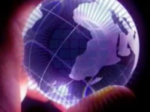 Glowing globe held in hand, symbolizing global justice and human rights.