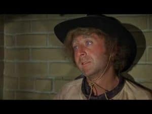 Gene Wilder in a cowboy hat, expressing a thoughtful expression. Personal identity.