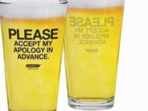 Two pint glasses of beer; one says "Please accept my apology in advance.