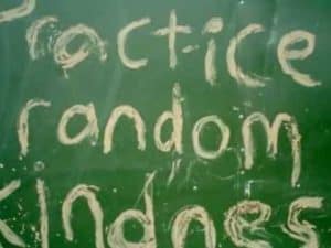 Chalkboard with the words "Practice Random Kindness" written on it.
