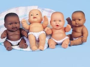 Four baby dolls of diverse ethnicities, showcasing biracial identities.