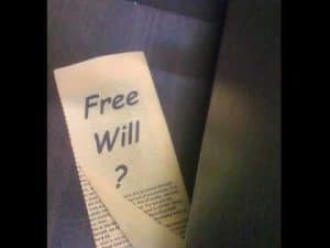 Close-up of a page with "Free Will?" written on it, questioning the concept of free will.
