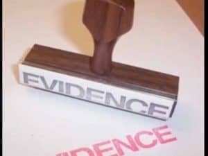 Wooden evidence stamp with "EVIDENCE" imprinted.