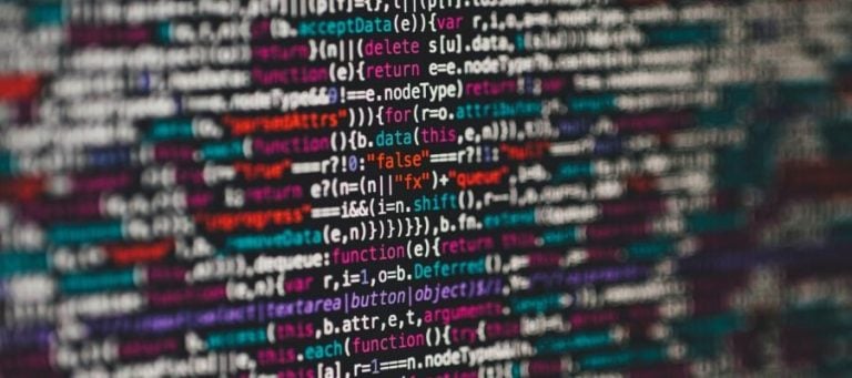 Abstract image of colorful code; a visual representation of programming and technology.