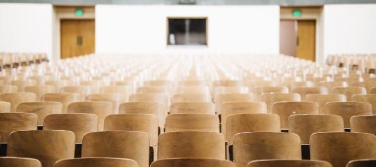 Empty auditorium chairs awaiting an audience.