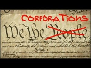 Image of the US Constitution with "Corporations" superimposed and "We the People" crossed out.