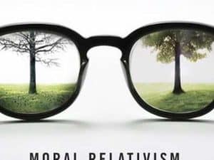 Eyeglasses reflecting contrasting landscapes: a barren tree and a lush tree, illustrating moral relativism.