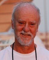 Portrait of a smiling older man with a white beard