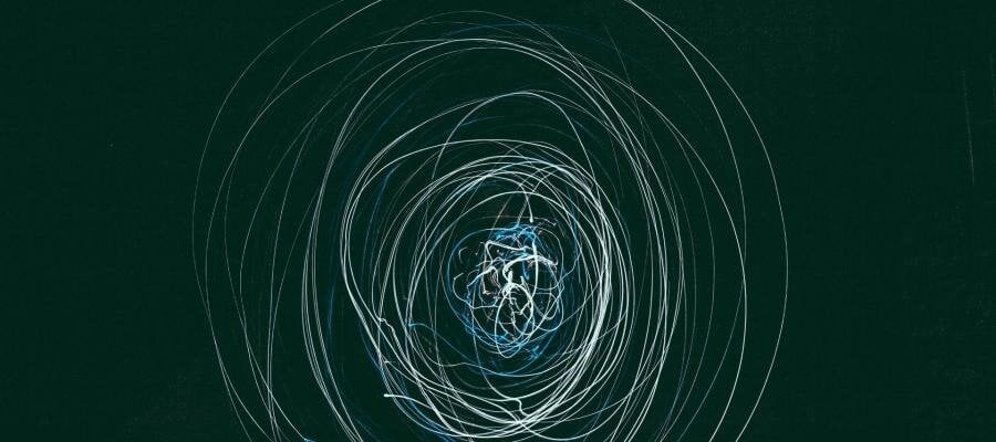 Abstract swirling light trails, suggesting concepts of science, philosophy, and theology.