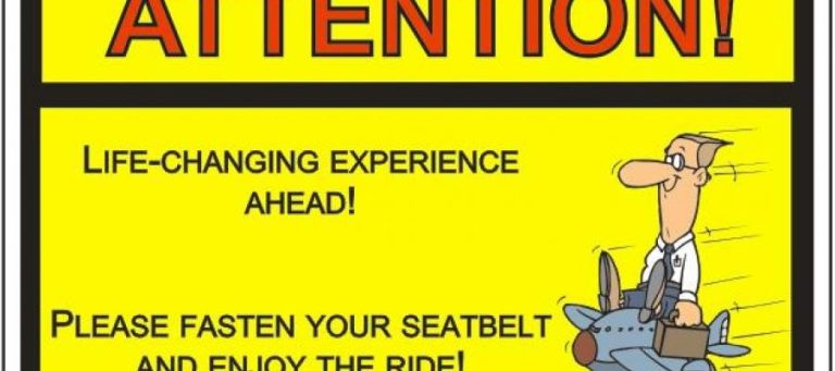 Cartoon of a man on a plane, text: "Attention! Life-changing experience ahead! Please fasten your seatbelt and enjoy the ride!