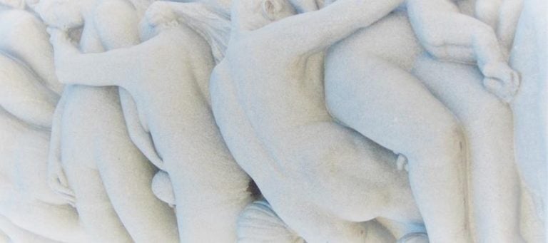 Abstract marble sculpture depicting intertwined figures, illustrating the evolution of storytelling through human connection.