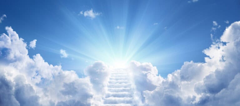 Stairway to heaven ascending through bright clouds and sunlight.