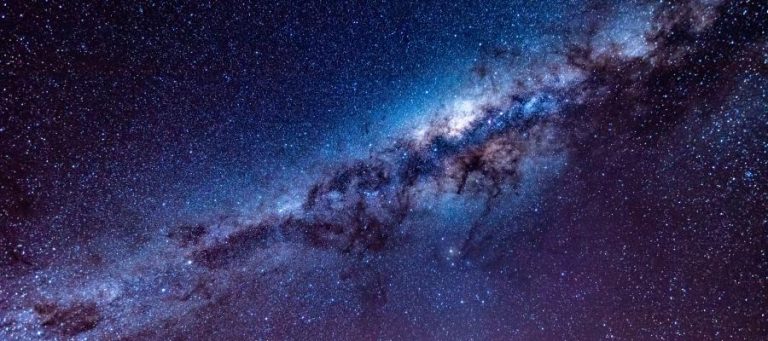 Stunning view of the Milky Way galaxy, a cosmic expanse prompting questions about existence.