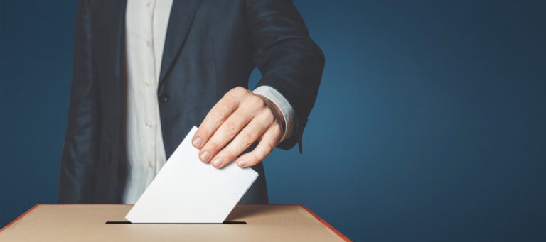 Person in suit casting ballot into a box. Dewey's Democracy