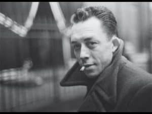 Black and white portrait of Albert Camus, author of The Stranger, embodying the philosophy of the absurd.