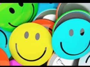 Colorful smiley face buttons representing the science of happiness.