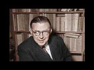 Jean-Paul Sartre, renowned philosopher, in a thoughtful pose.