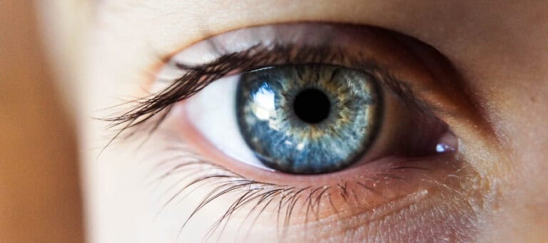 Close-up of a person's blue eye.