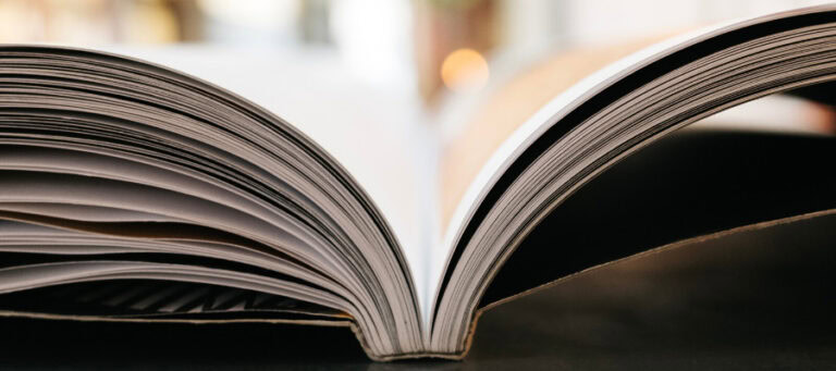 Open book, pages fanned out, suggesting reading and learning about Habermas and democracy.