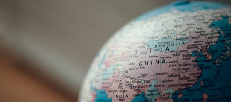 Close-up of a globe showing China, Mongolia, and surrounding countries.