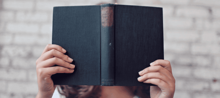 Person holding a book titled "If Winter Comes." Midlife crisis reflection.