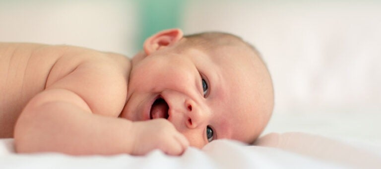 Happy baby lying on its stomach