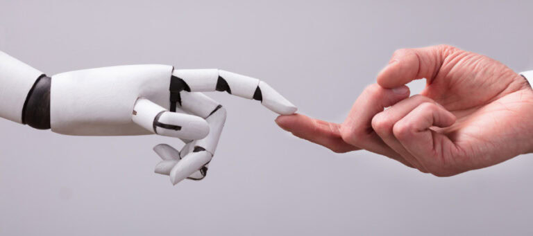 A robotic hand and a human hand touch fingertips, symbolizing the connection between technology and humanity.