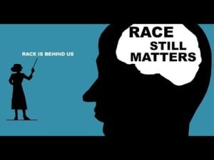 Silhouette of a person with "Race Still Matters" in their mind, contrasted with a teacher saying "Race is behind us.