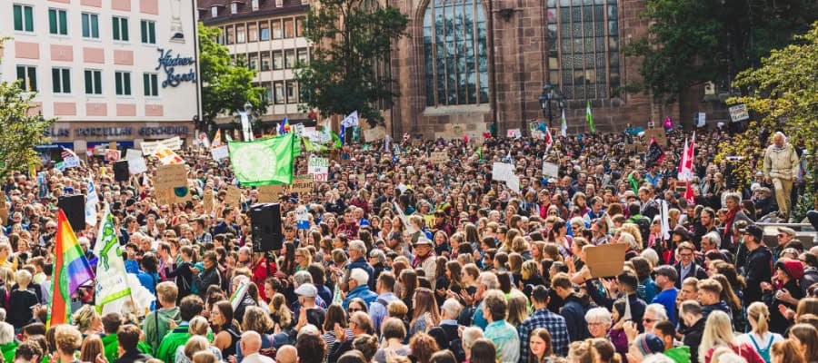 Large crowd of people protesting climate change.