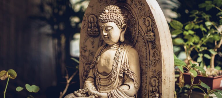 Serene Buddha statue, peaceful expression, ornate details.