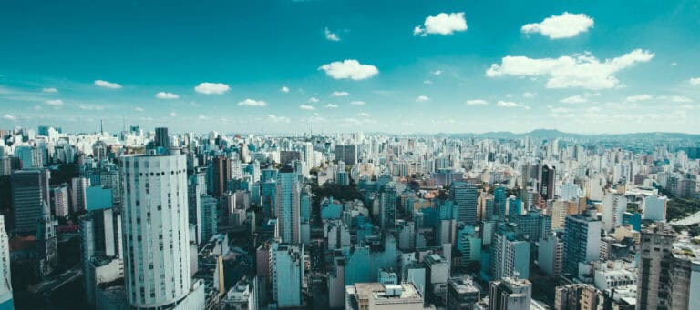 Aerial view of a sprawling city, showcasing dense urban development.