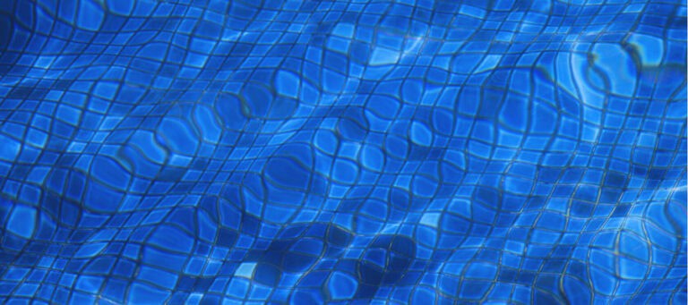 Abstract image of blue water rippling over a tiled surface.