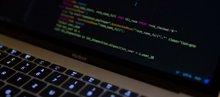 Laptop screen displaying SQL code; "Criminal" concept.