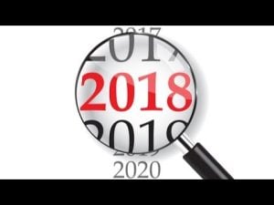Magnifying glass focusing on the year 2018, surrounded by other years.