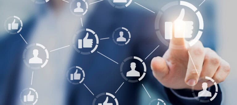 Person interacting with a network of social media icons, including thumbs up and user profiles.
