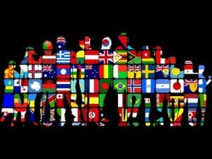 Silhouettes of diverse people formed from world flags, symbolizing immigration and multiculturalism.