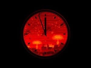 Clock face showing midnight with a fiery apocalyptic scene.