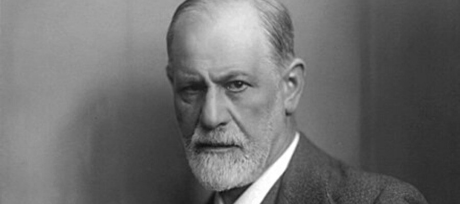 Black and white portrait of Sigmund Freud, known for his work on psychoanalysis.