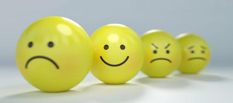 Four yellow emoticon balls showing different emotions: sad, happy, angry, and unhappy.