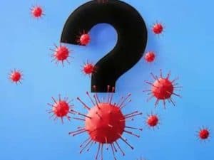 Question mark surrounded by red coronavirus particles; Covid conundrums.