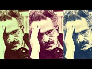 Triptych portrait of Walter Benjamin, philosopher, with hand to forehead.
