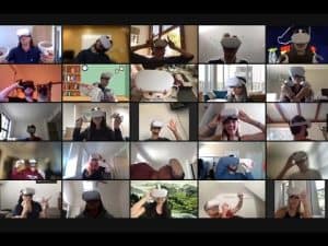 Virtual reality meeting: diverse group wearing VR headsets, engaged in online collaboration.