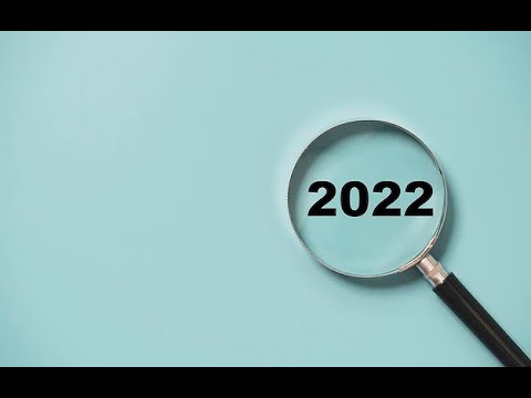 Magnifying glass focusing on the year 2022. Examining 2022.